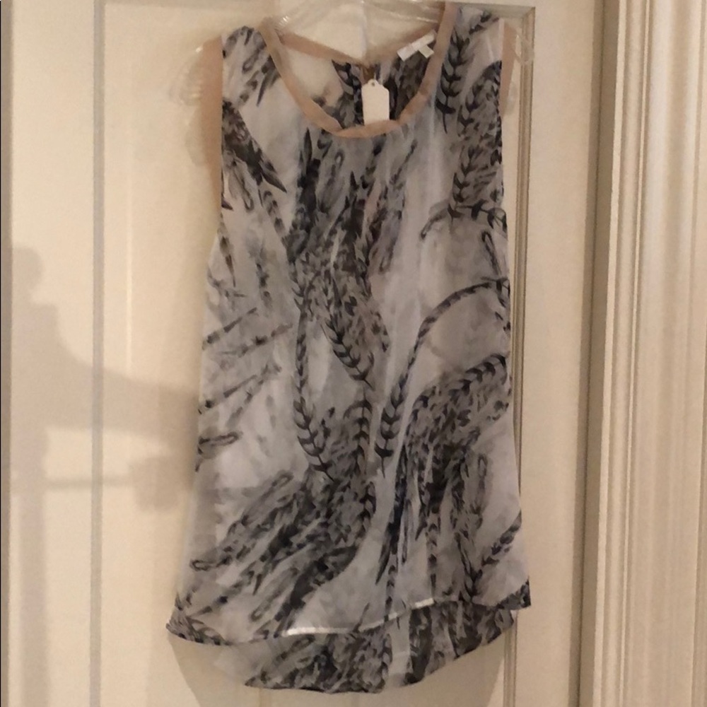 Black and gray print blouse with bow accent